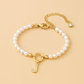 Auden Clé Letter Charm Bracelet in Gold